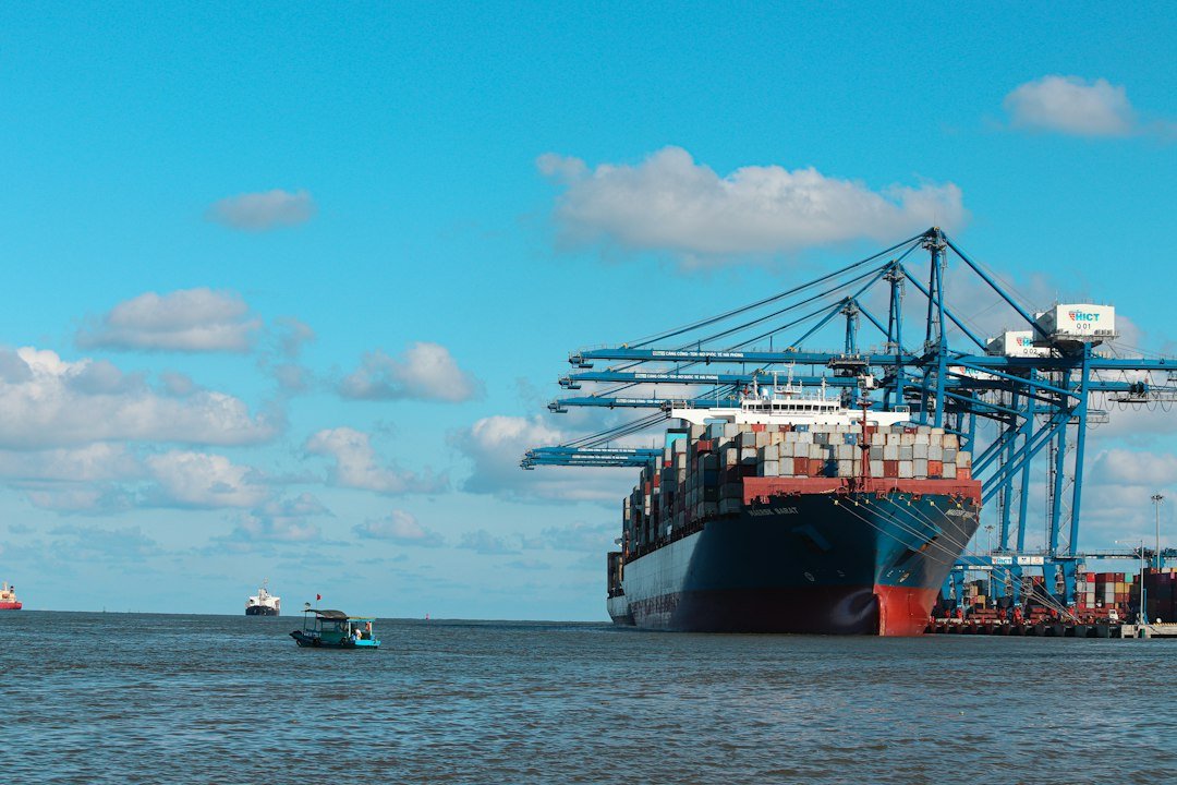 Container carrier waiting to take off. Hai Phong International Container Terminal (HICT), Vietnam (Jully 2022)